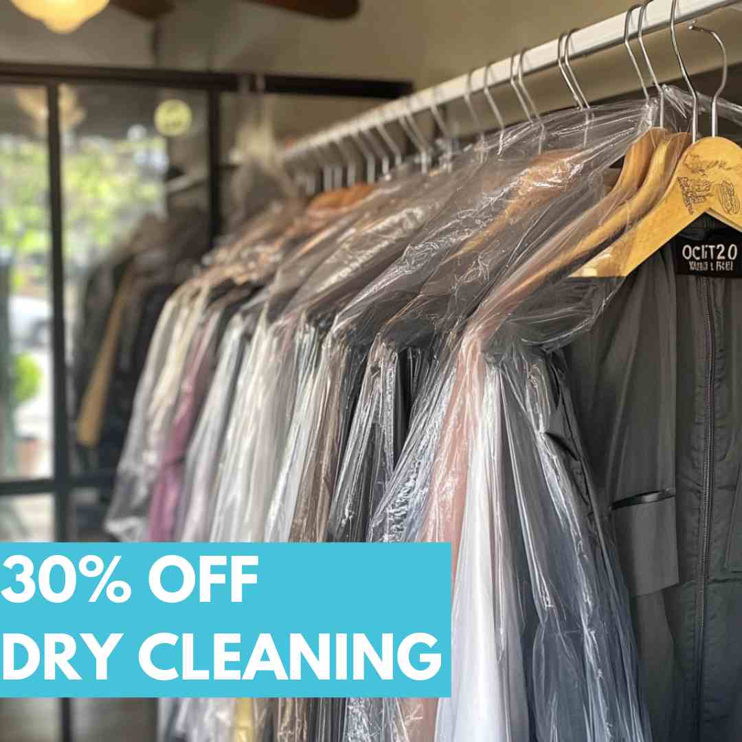 Clothes on hangers covered in plastic at a dry cleaner, with a sign reading "30% OFF DRY CLEANING" in bold text.